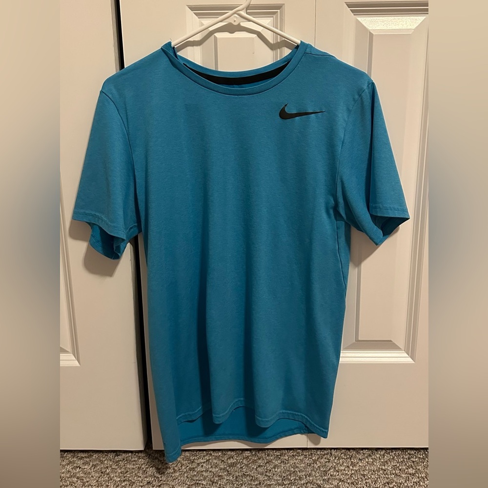 Light blue athletic Nike shirt. Excellent condition.